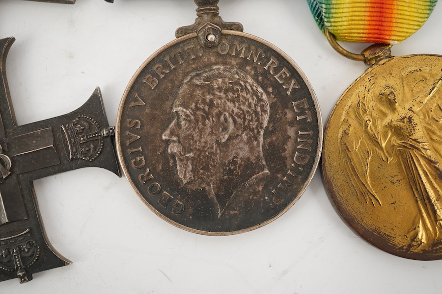 A George V First World War Military Cross (MC) medal group, comprising of a military cross, British war medal, and the victory medal. Condition - poor, the name of the recipient has been removed leaving only ‘W. York R.’